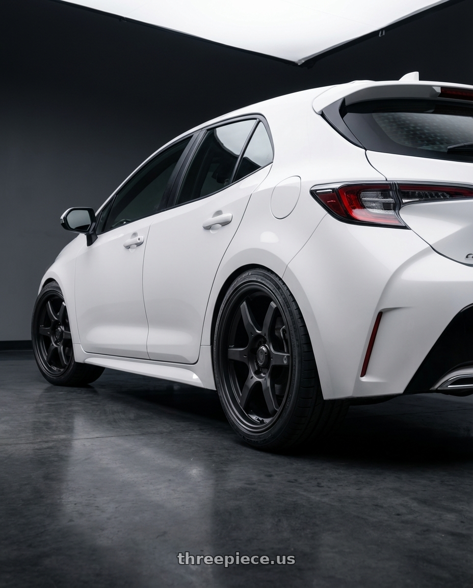2023 Toyota Corolla Hatchback with Konig Backbone 5x114.3 18x8+35 Matte Black Milling Logo on Spoke wheels rear three quarter view square tires