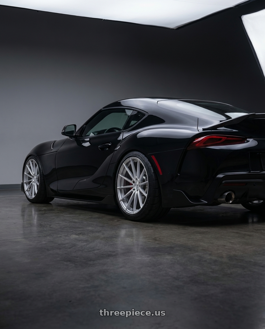 2026 TOYOTA SUPRA FINAL EDITION  with TSW TW005 GOODWOOD 5X112 19x9.5 +25 HYPER SILVER wheels rear three quarter view meaty tires