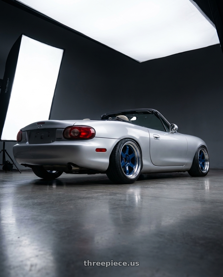 2000 Mazda Miata with Volk Racing TE37V 5x114.3 17x9.5 +15 MAG BLUE wheels rear three quarter view extreme stretch tires