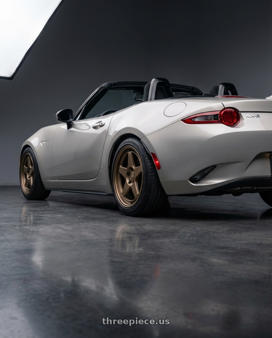 2021 Mazda MX-5 Miata ND with Kansei K12B KNP 5x114.3 17x9.5 12 Bronze wheels rear three quarter view square tires