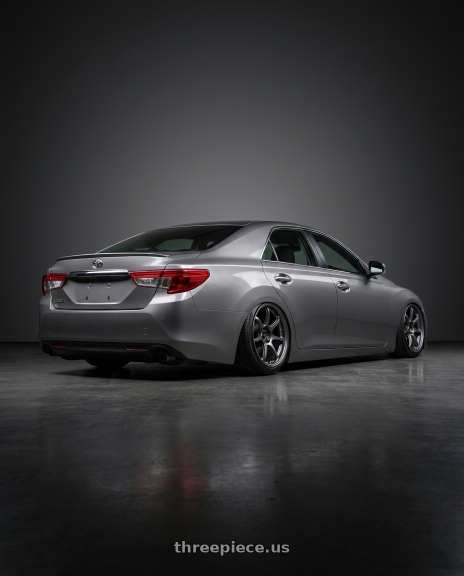 2014 Toyot reiz with Enkei PF09 5x114.3 18x8.5+45 Dark Silver wheels rear three quarter view slight stretch tires