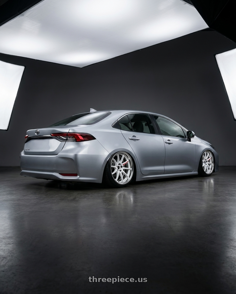 2025 Toyata altis with Work Zr10 2P 5x100 18x10.0 +45 Azure White wheels rear three quarter view slight stretch tires