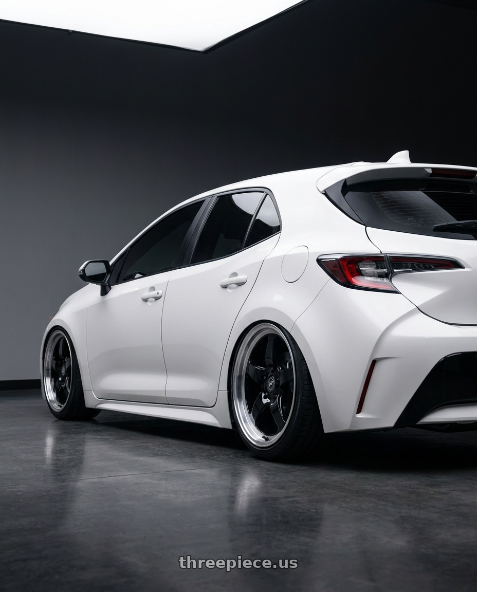 2023 Toyota Corolla Hatchback with Forgestar D5 Drag 5x114.3 18x10 +42 Gloss Black Machined wheels rear three quarter view slight stretch tires