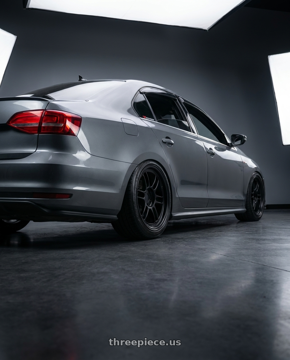 2016 vw gli with Enkei RPF1 5x112 18x9+35 Black wheels rear three quarter view slight stretch tires