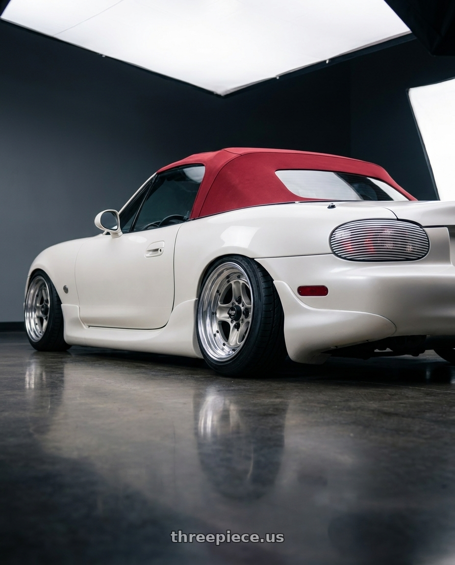 2001 Mazda Miata  with Work Equip 40 4x100 15x7 -16 a disk Brut Silver wheels rear three quarter view extreme stretch tires