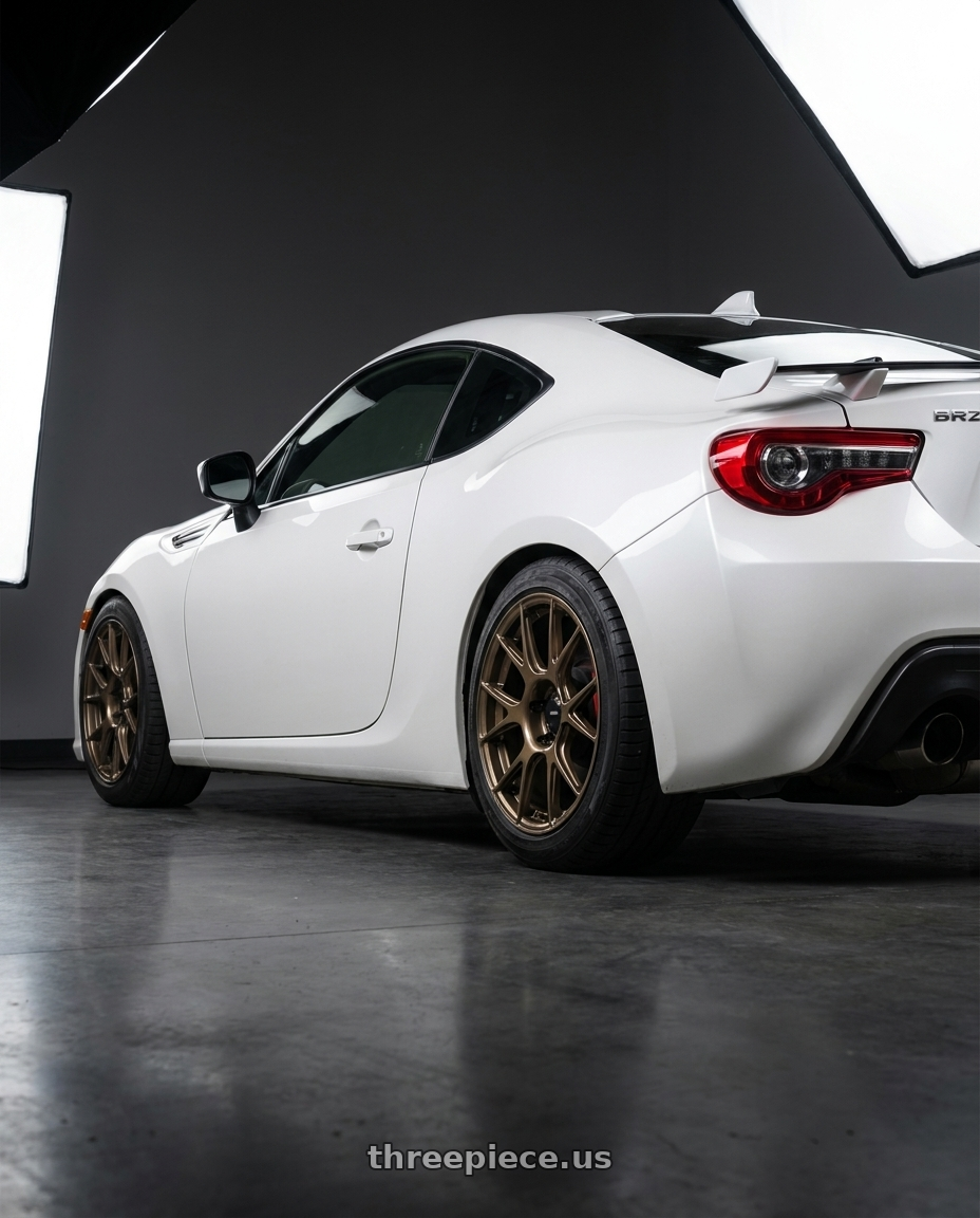 2017 Subaru BRZ with Konig Ampliform 5x100 17x8+40 Gloss Bronze wheels rear three quarter view square tires