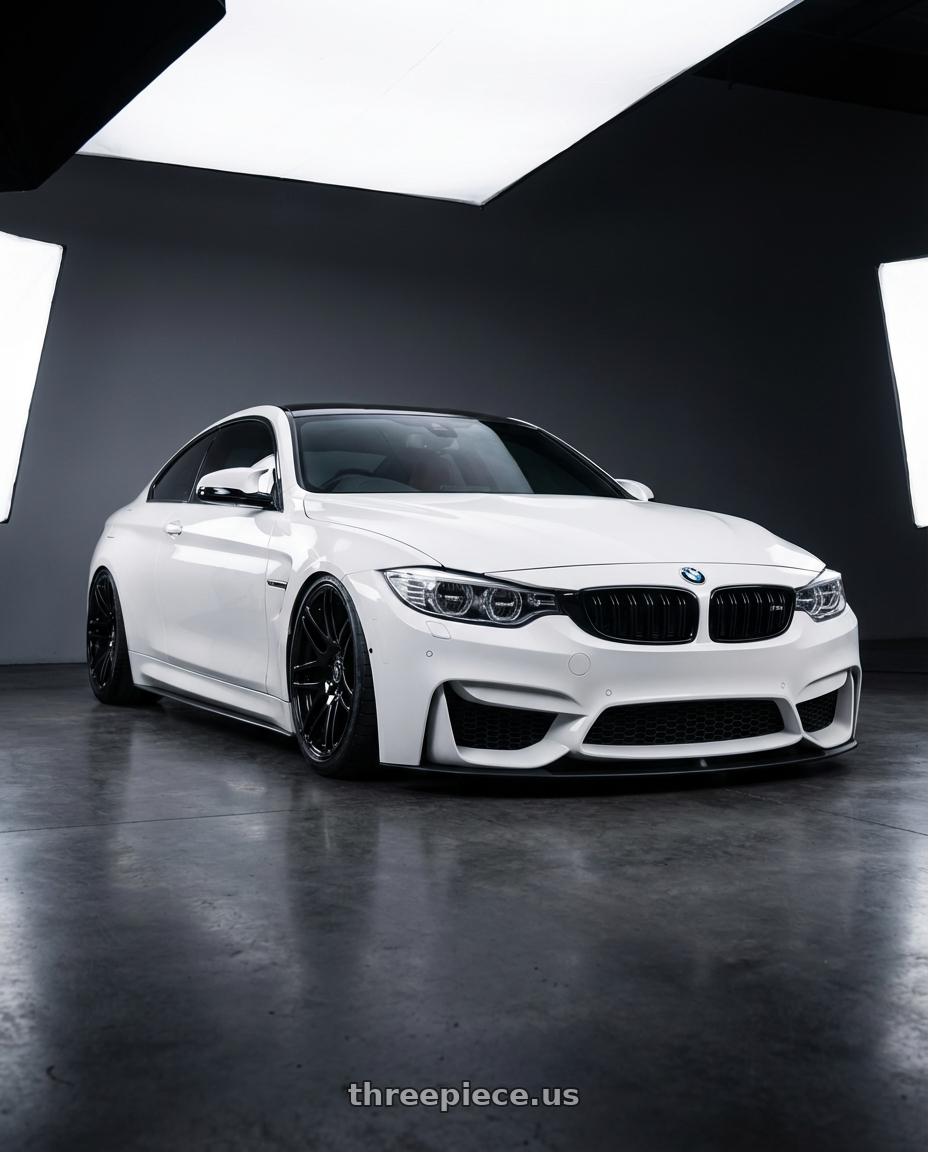2018 BMW M4 F82 with Forgestar F14 5x120 19x9 +38 Gloss Black wheels front three quarter view stanced stance