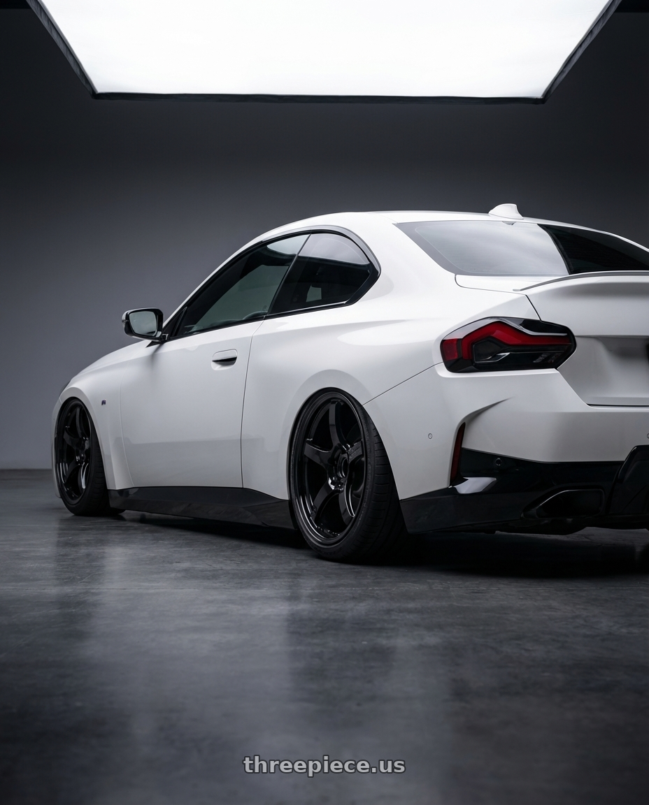 2024 BMW 2 Series G42 with Gram Lights 57CR 5x112 19x9.5+45 Glossy Black wheels rear three quarter view slight stretch tires