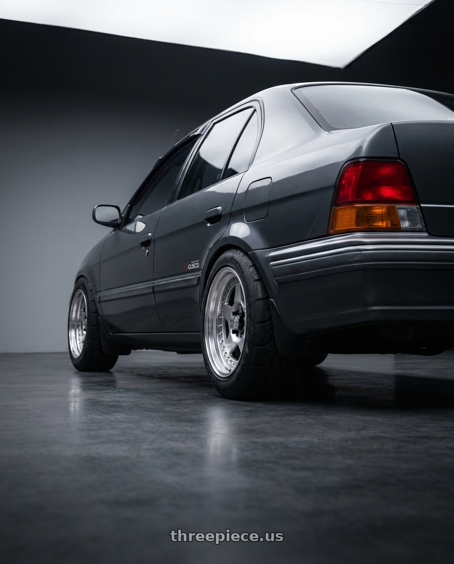 1996 Toyota Tercel EL51 with Work Meister Cr01 4x100 15x8+35 A Disk Bright Buff Finish wheels rear three quarter view meaty tires