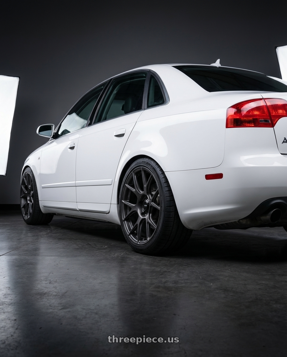 2010 Audi A4 B7 with Konig Ampliform 5x112 18x8.5+43 Dark Metallic Graphite wheels rear three quarter view square tires