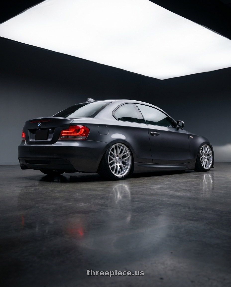 2012 BMW 1 Series E82 with Avant Garde Wheels M359 5X120 19x9 +18 Hyper Silver wheels rear three quarter view slight stretch tires