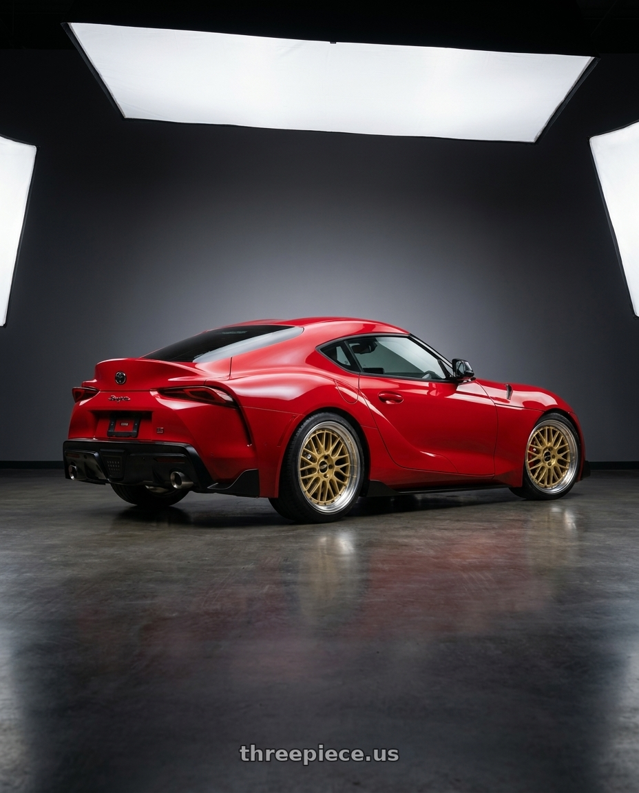 2022 Toyota supra with BBS LM 5x112 19x9.0+42 Gold wheels rear three quarter view square tires