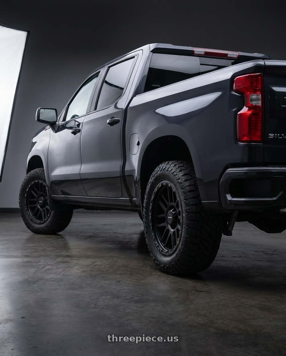 2023 Chevrolet Silverado 1500 with Vision Off-Road 111 Nemesis 6x139.7 20x9+10 Matte Black wheels rear three quarter view meaty tires