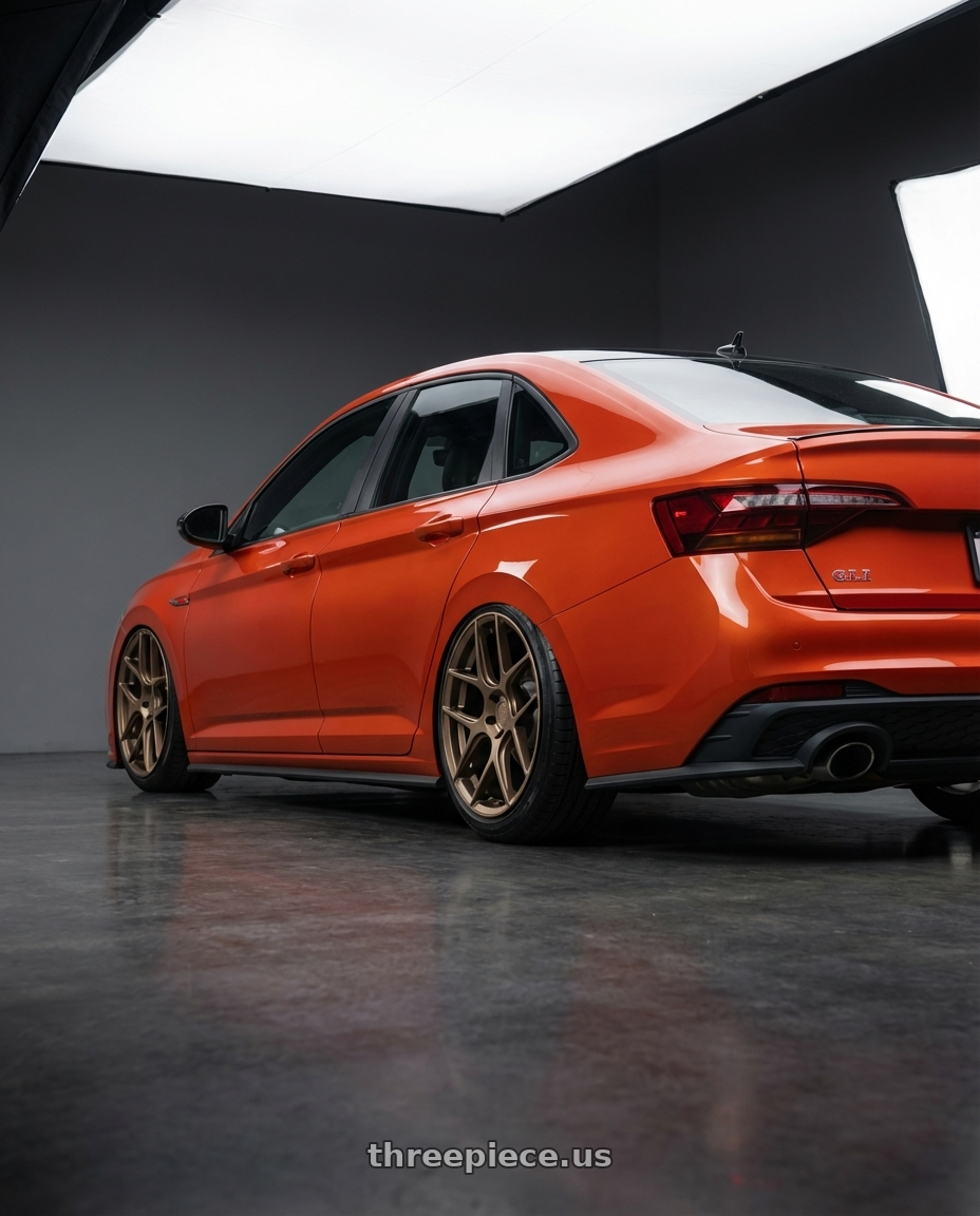 2023 Volkswagen Jetta GLI MK7 with Aodhan AFF2 5x112 19x8.5+35 Matte Bronze wheels rear three quarter view slight stretch tires