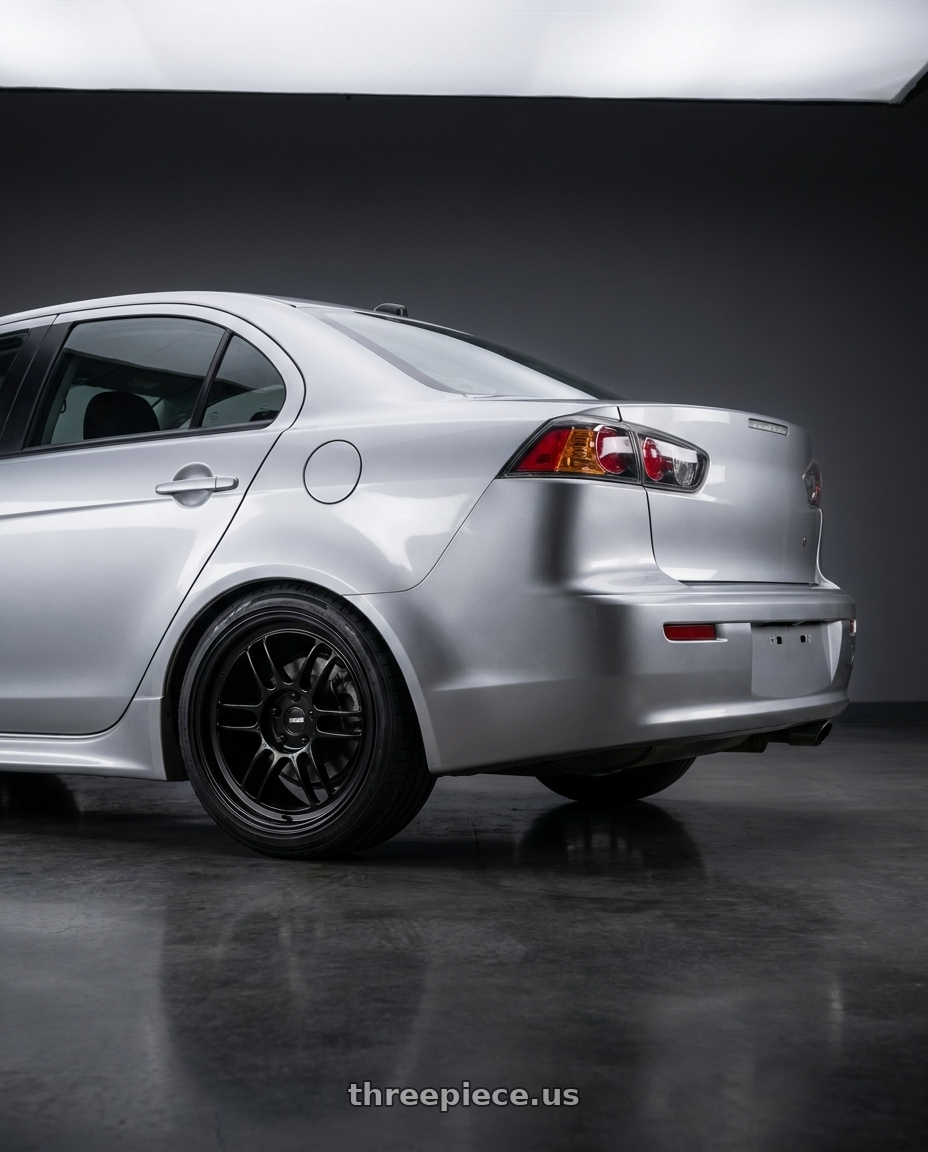 2008 Mitsubishi Lancer IO with Enkei RPF1 5x114.3 18x9.5+15 Gloss Black wheels rear three quarter view square tires