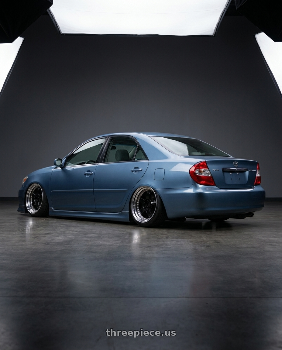 1998 Toyota Prius  with Work Meister S1 3P 5x100 18x7+35 A Disk Black wheels rear three quarter view slight stretch tires