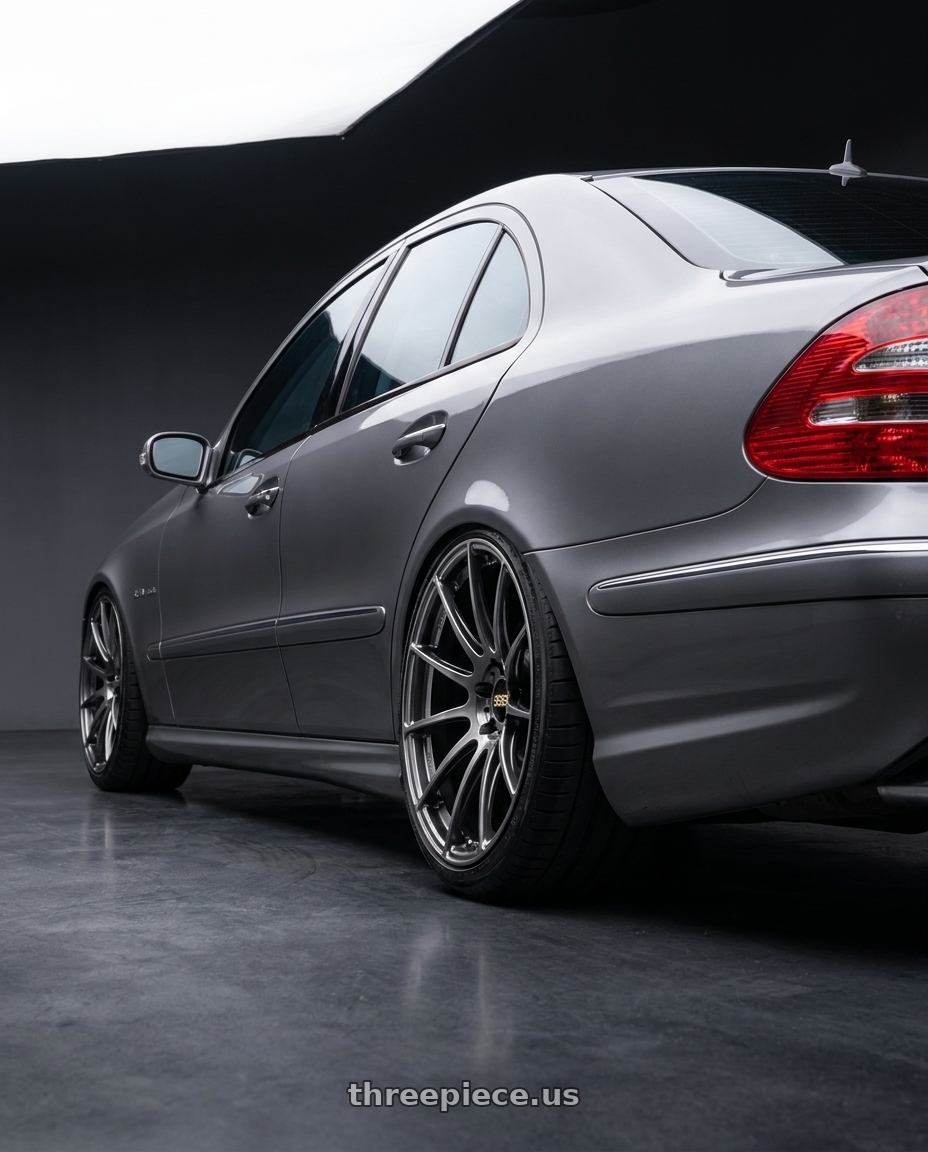 2006 Mercedes E55 AMG with BBS FS 5x112 19x10 +38 PFS Diamond Black wheels rear three quarter view extreme stretch tires
