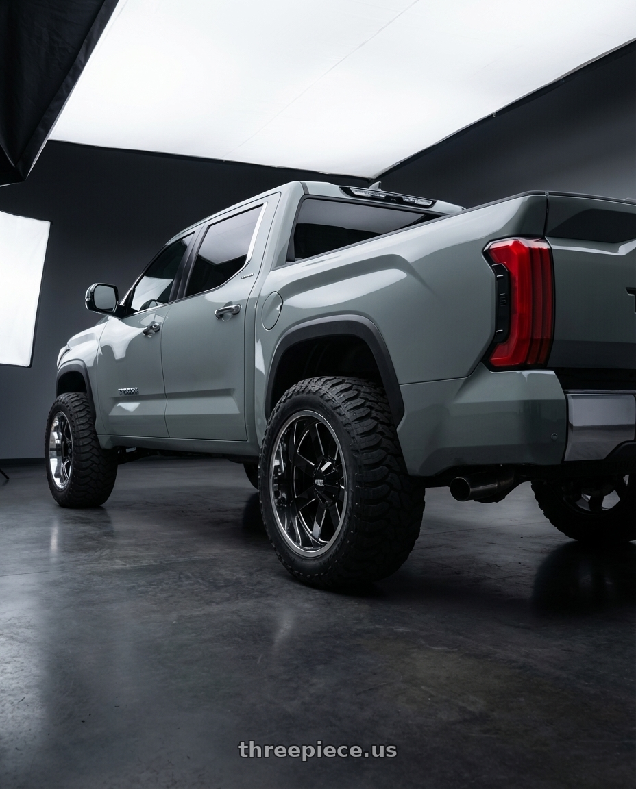 2024 Toyota Tundra with Moto Metal MO200 6X139.7 20X10 -18 GLOSS BLACK MILLED CENTER CHROME LIP wheels rear three quarter view meaty tires