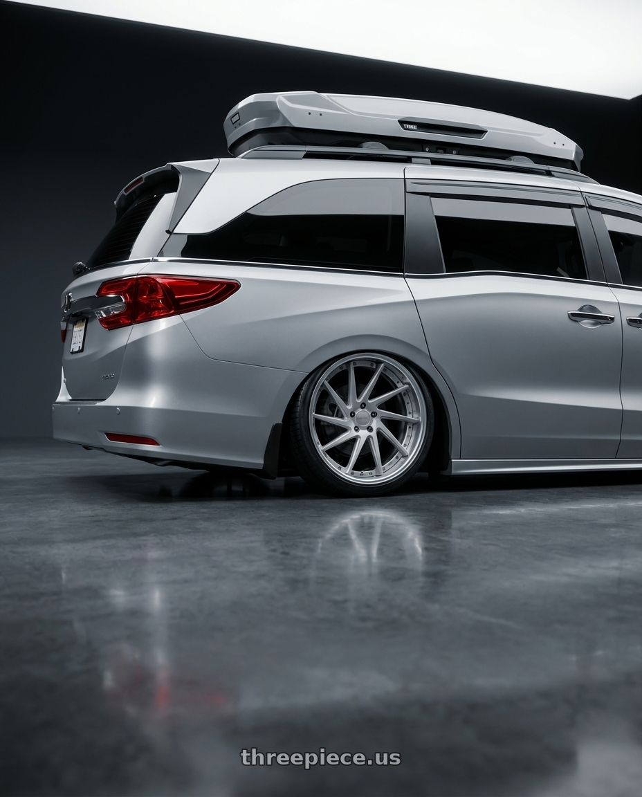 2024 Honda Odyssey with Work Gnosis Cvs 5x120 19x8+38 O Disk Matte Silver wheels rear three quarter view slight stretch tires