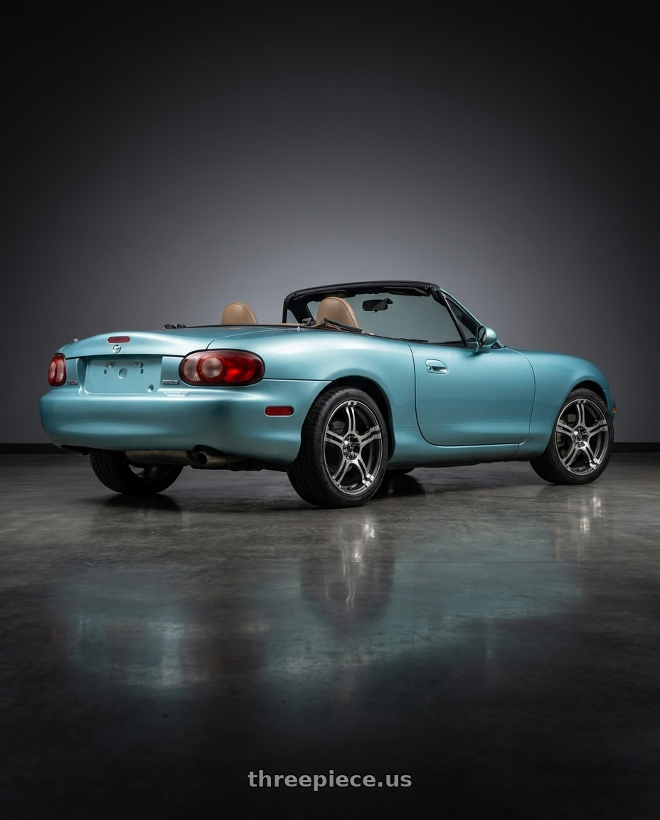 2002 Mazda Miata with Konig 48A Incident 4x100 / 4x108 14x6 +38 Graphite With Machined Face wheels rear three quarter view square tires