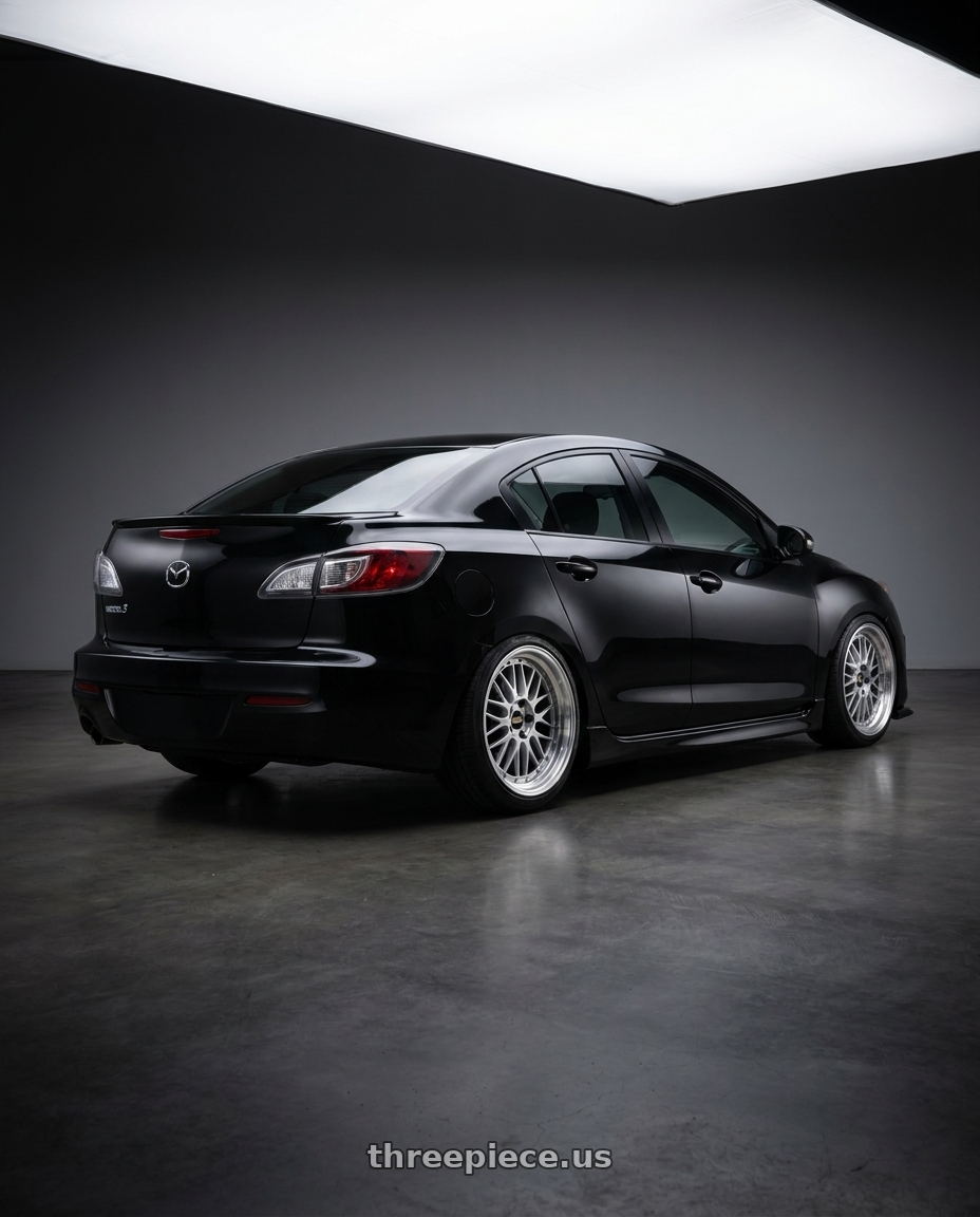 2012 Mazda 3 S with BBS LM 5x114.3 18x8.0+40 Diamond Silver wheels rear three quarter view slight stretch tires