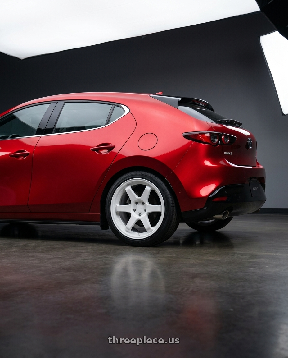 2024 Mazda 3 with 9six9 SIX-1 5x114.3 18X8.5 +35 Competition White wheels rear three quarter view slight stretch tires