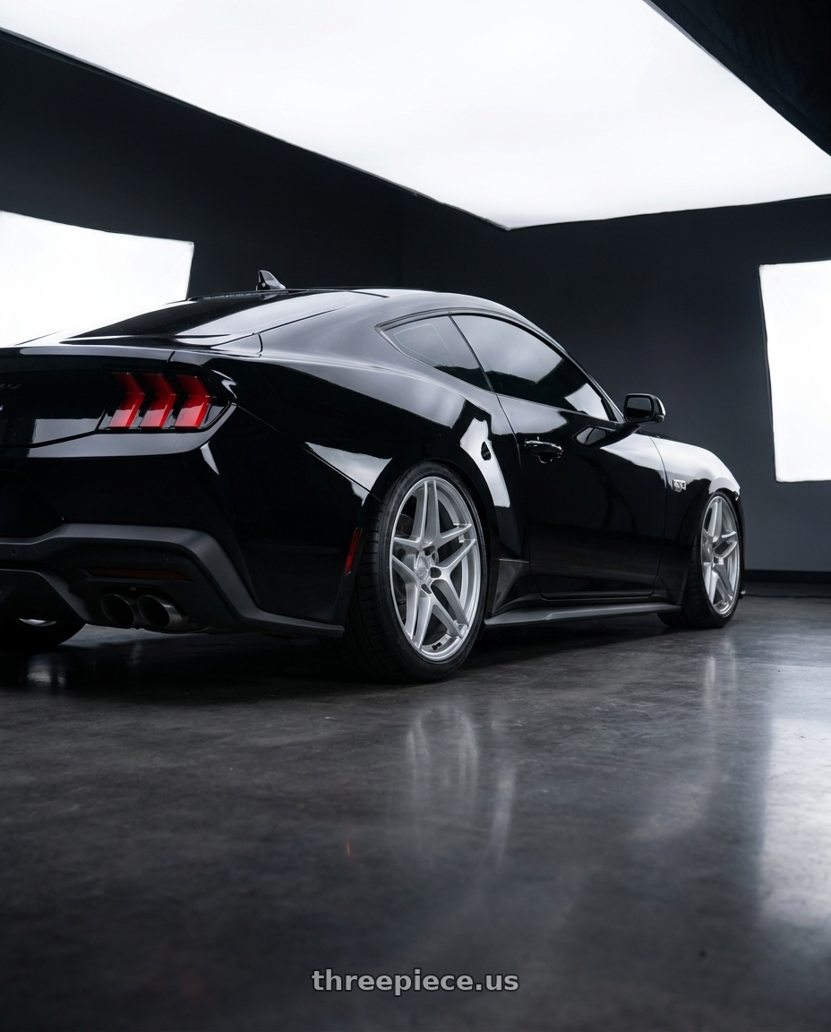 2024 ford mustang gt with Kansei K15H Astro 5x114.3 19x9.5 35 Hyper Silver wheels rear three quarter view slight stretch tires