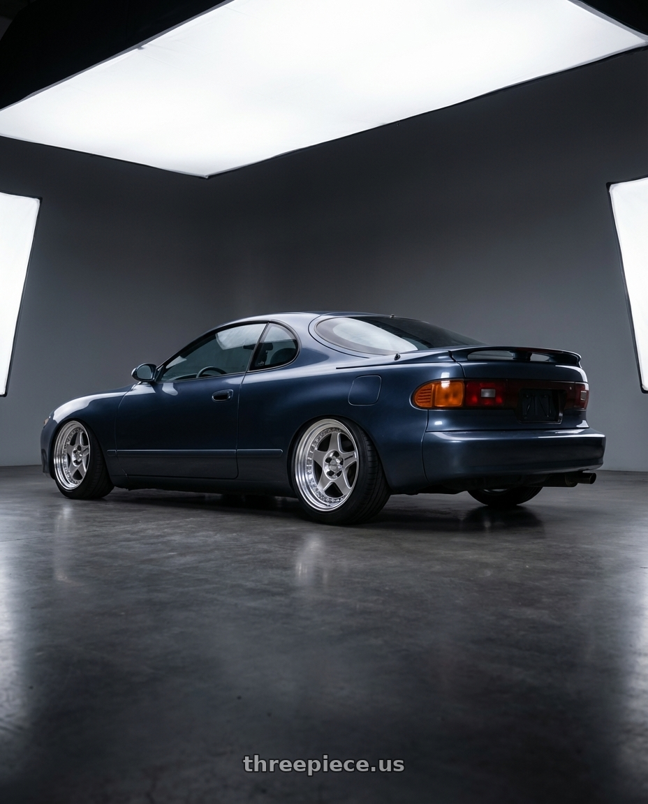 1990 toyota celica  with Work Meister Cr01 4x100 16x7+35 A Disk Bright Buff Finish wheels rear three quarter view slight stretch tires