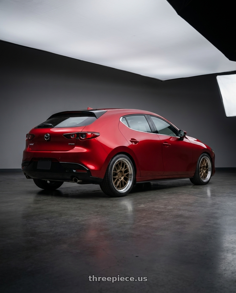 2026 Mazda 3 hatchback soul red with Aodhan DS06 5x114.3 18x8.5+35 Bronze w/Machined Lip wheels rear three quarter view square tires