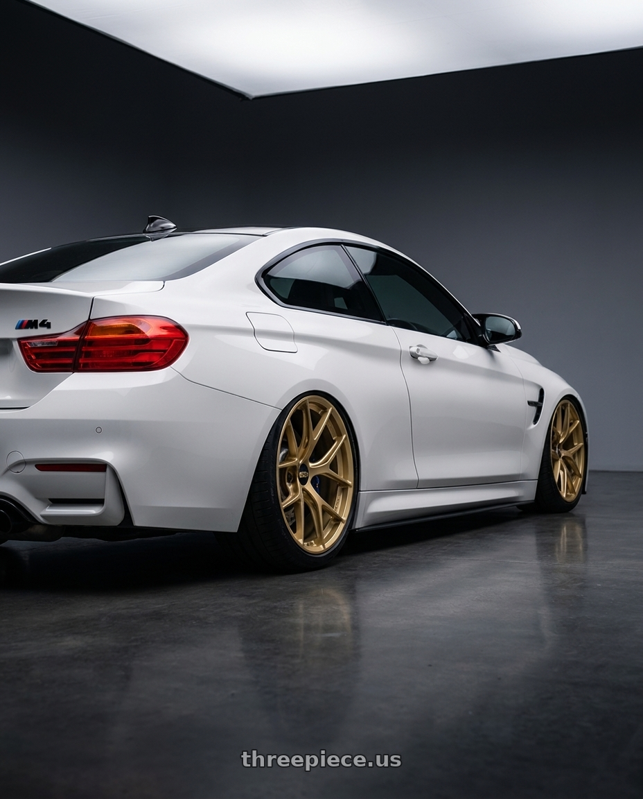 2018 BMW M4 F82 with BBS FI-R 5x120 19x10.5+35 Gold wheels rear three quarter view slight stretch tires