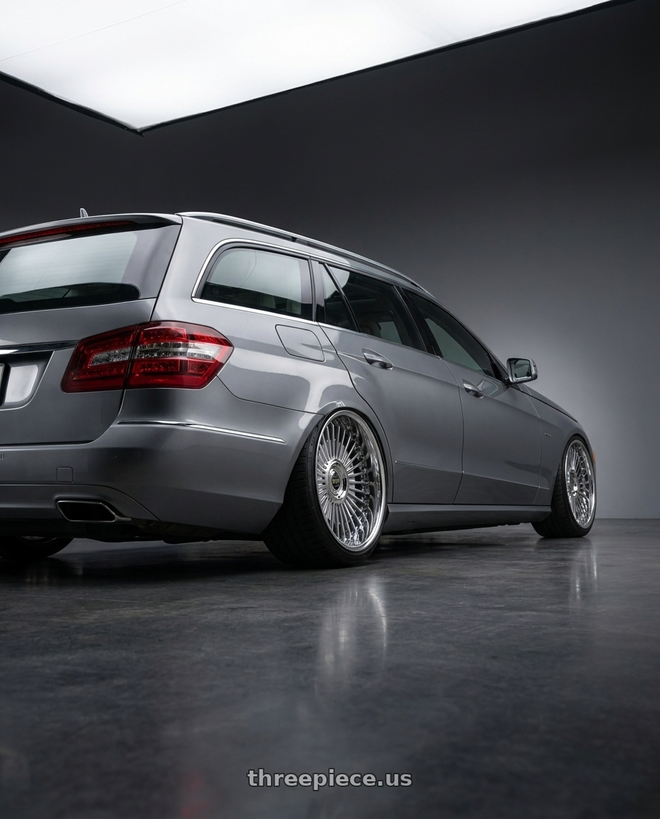 2010 Benz s212 with Work Emitz Black Polish 5x100 19x9.0 +38 wheels rear three quarter view slight stretch tires