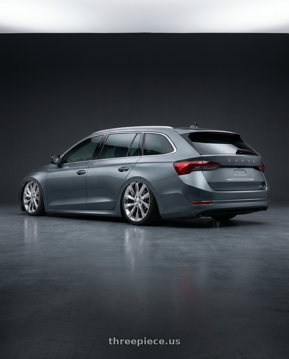 2023 Octavia combi with REPLICA 205 6X139.7 24x10 +28 CHROME wheels rear three quarter view slight stretch tires
