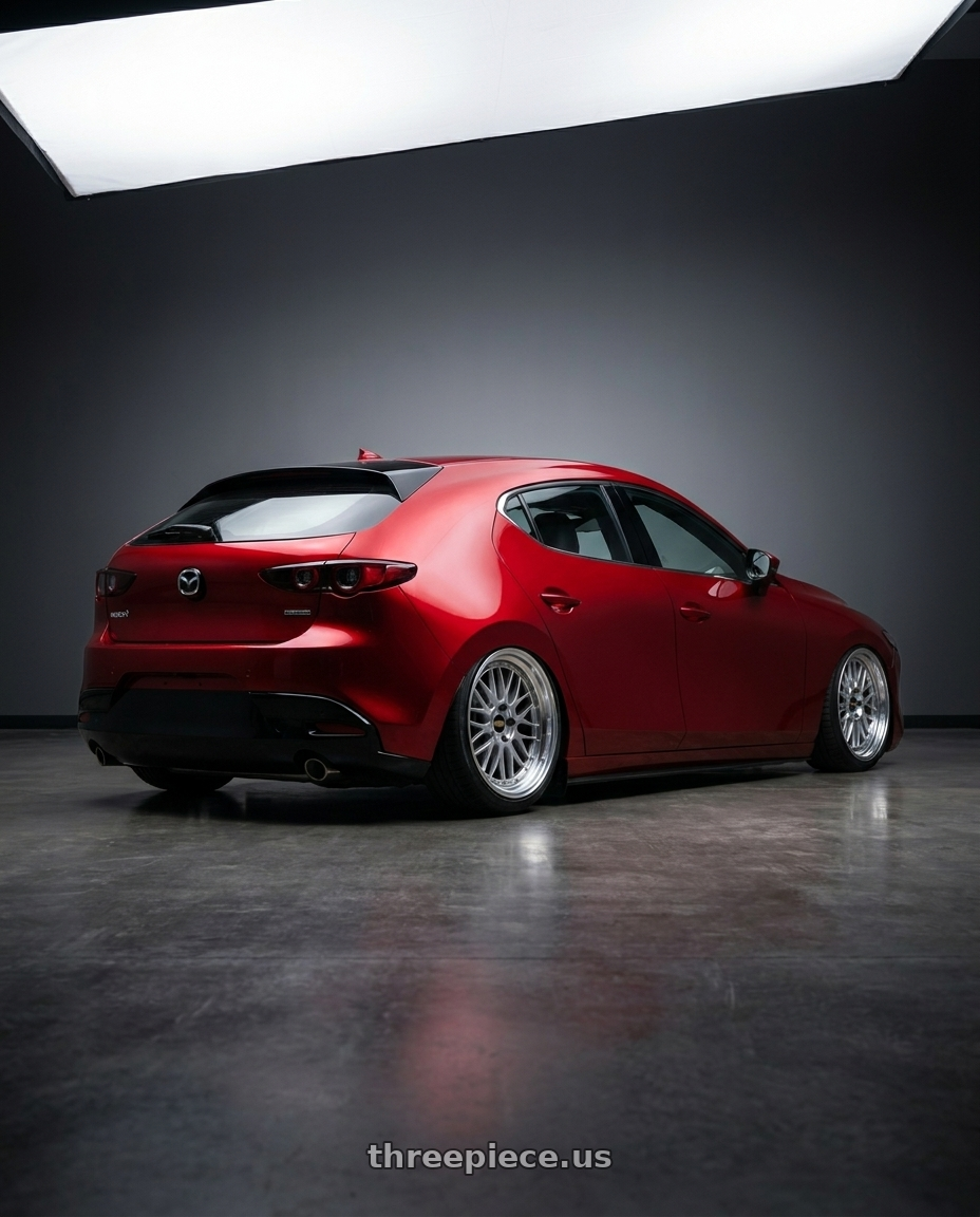 2021 Mazda3 5d with BBS LM 5x112 19x9.0+42 Diamond Silver wheels rear three quarter view slight stretch tires