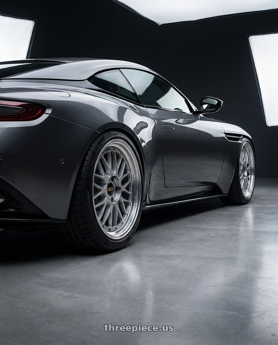 2019 Aston Martin DB11 with BBS LM 5x114.3 18x10.0+25 Diamond Silver wheels rear three quarter view square tires