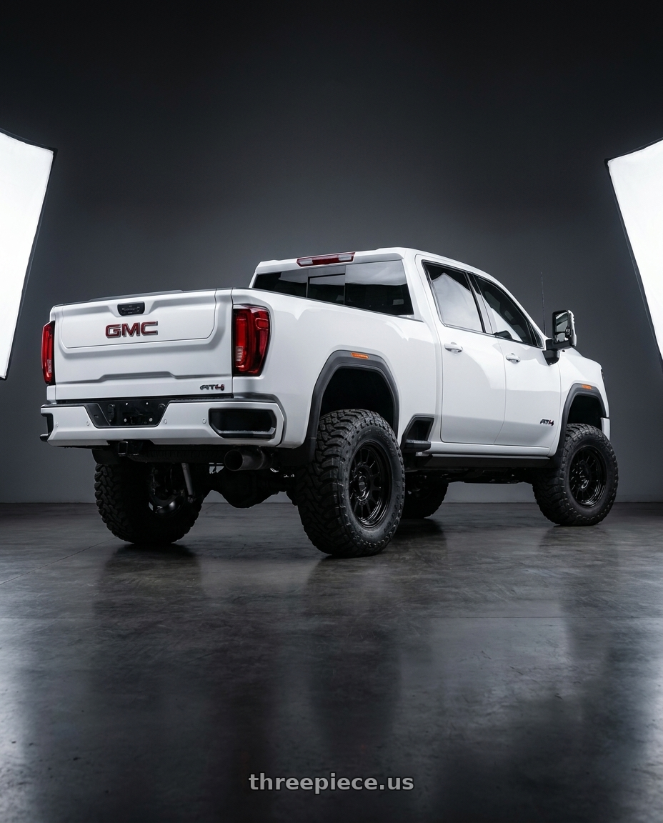2023 GMC sierra HD AT4 with Method Race Wheels 318B 6X135 17x8.5 +0 GLOSS BLACK wheels rear three quarter view meaty tires