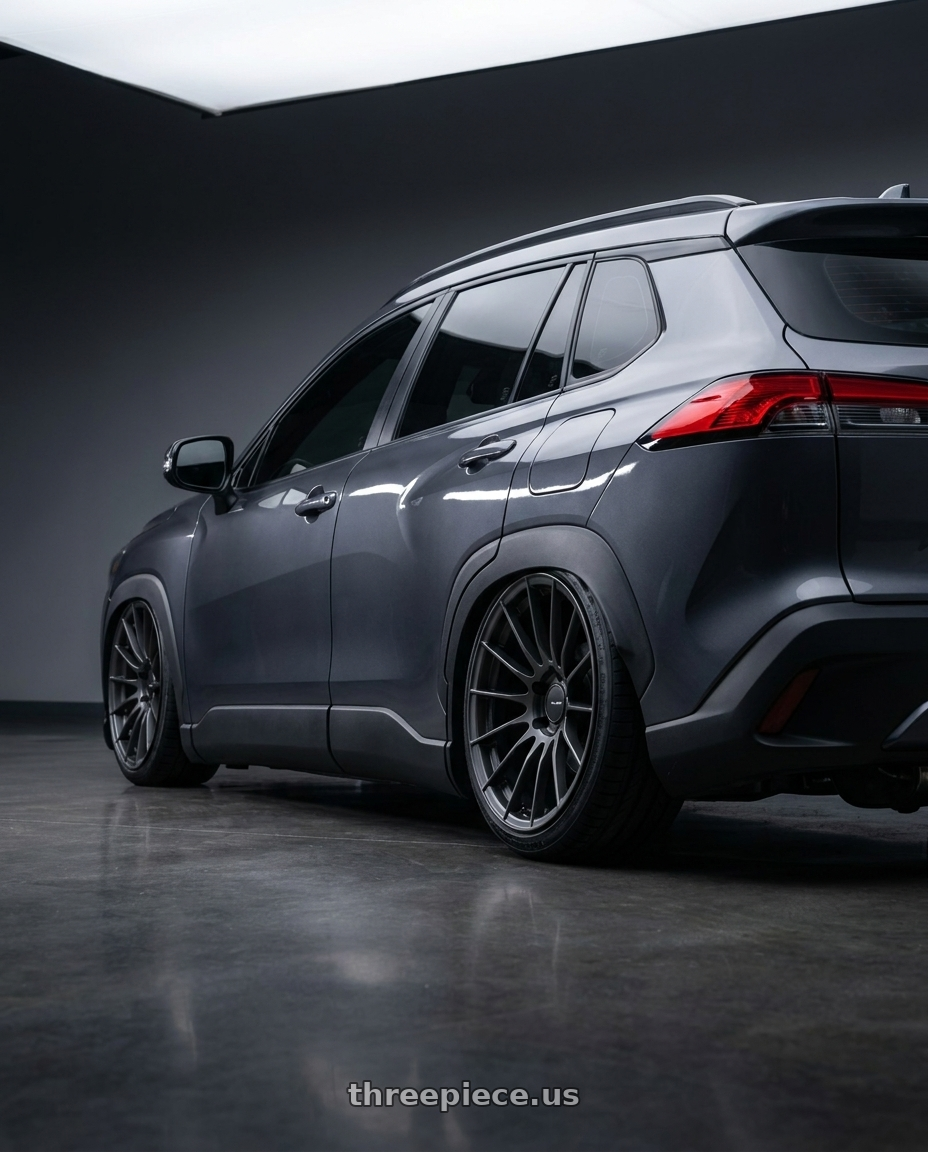 2023 Toyota Corolla cross with Enkei RS05-RR 5x112 18x9+25 Matte Gunmetal wheels rear three quarter view slight stretch tires