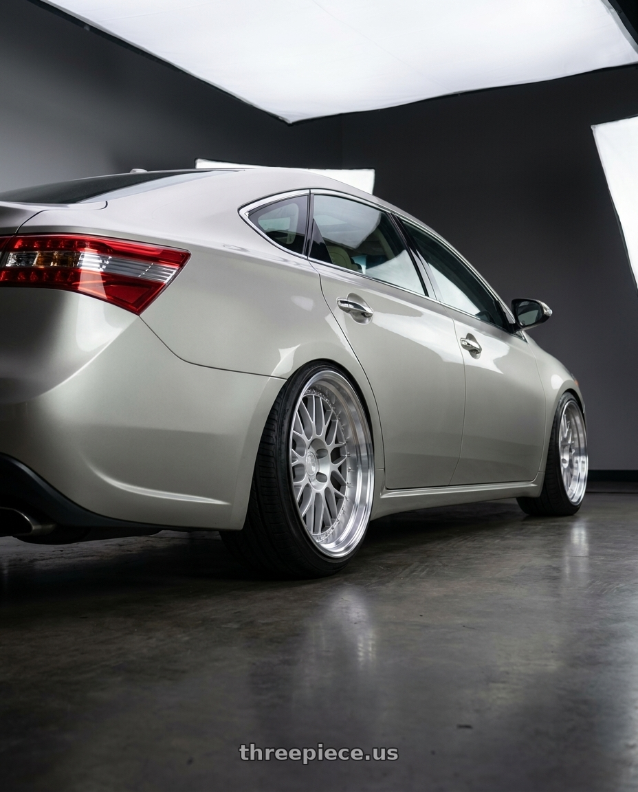 2013 toyota avalon with Aodhan AH02 5x114.3 18x8.5+35 Silver w/ Machined Lip wheels rear three quarter view extreme stretch tires