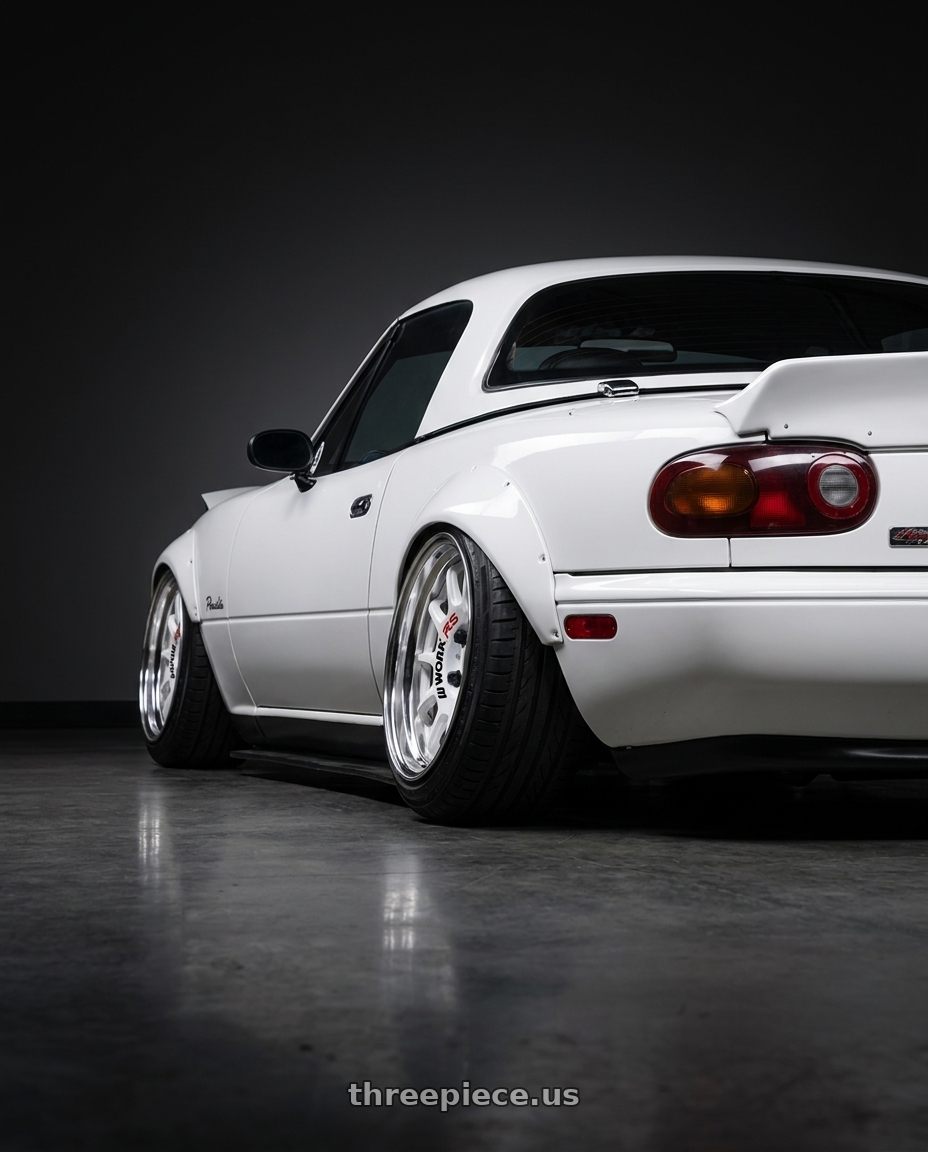 1993 Mazda Miata with Work Emotion Rs11 2p wheels rear three quarter view extreme stretch tires