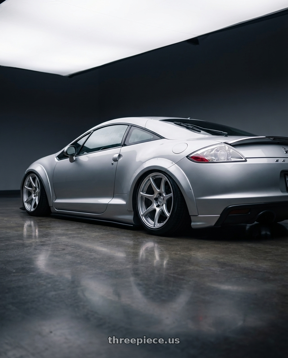 2010 Mitsubishi Eclipse with Kansei K11S Tandem 5x114.3 19x9.5 12 Hyper Silver wheels rear three quarter view slight stretch tires