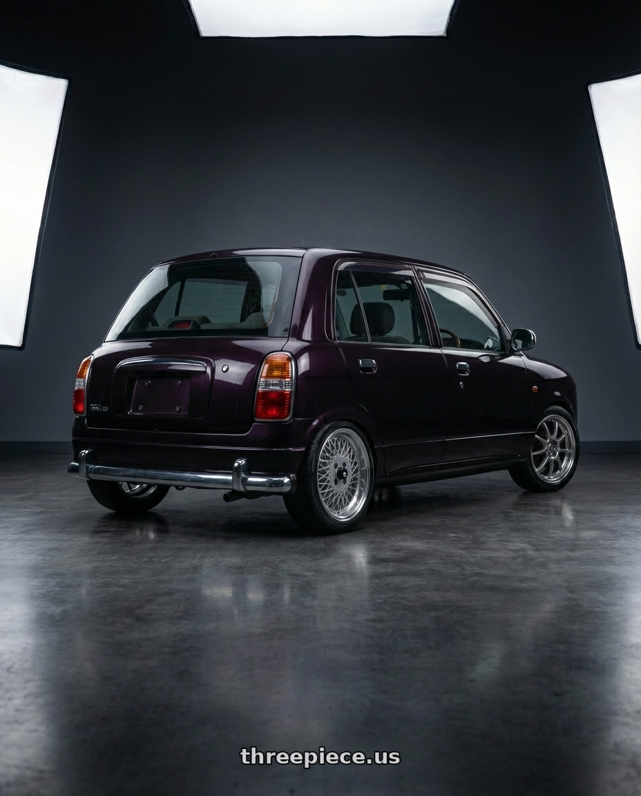 2000 Daihatsu Mira Gino  with Enkei Enkei92 Classic Line 4x100 15x7+38 Silver wheels rear three quarter view slight stretch tires