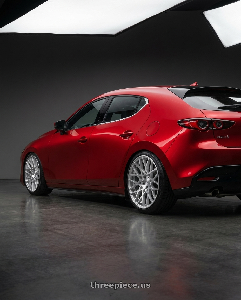 2024 Mazda 3 with Rotiform 1PC R110 BLQ 5X114.3 19X8.5 +38 GLOSS SILVER MACHINED wheels rear three quarter view slight stretch tires