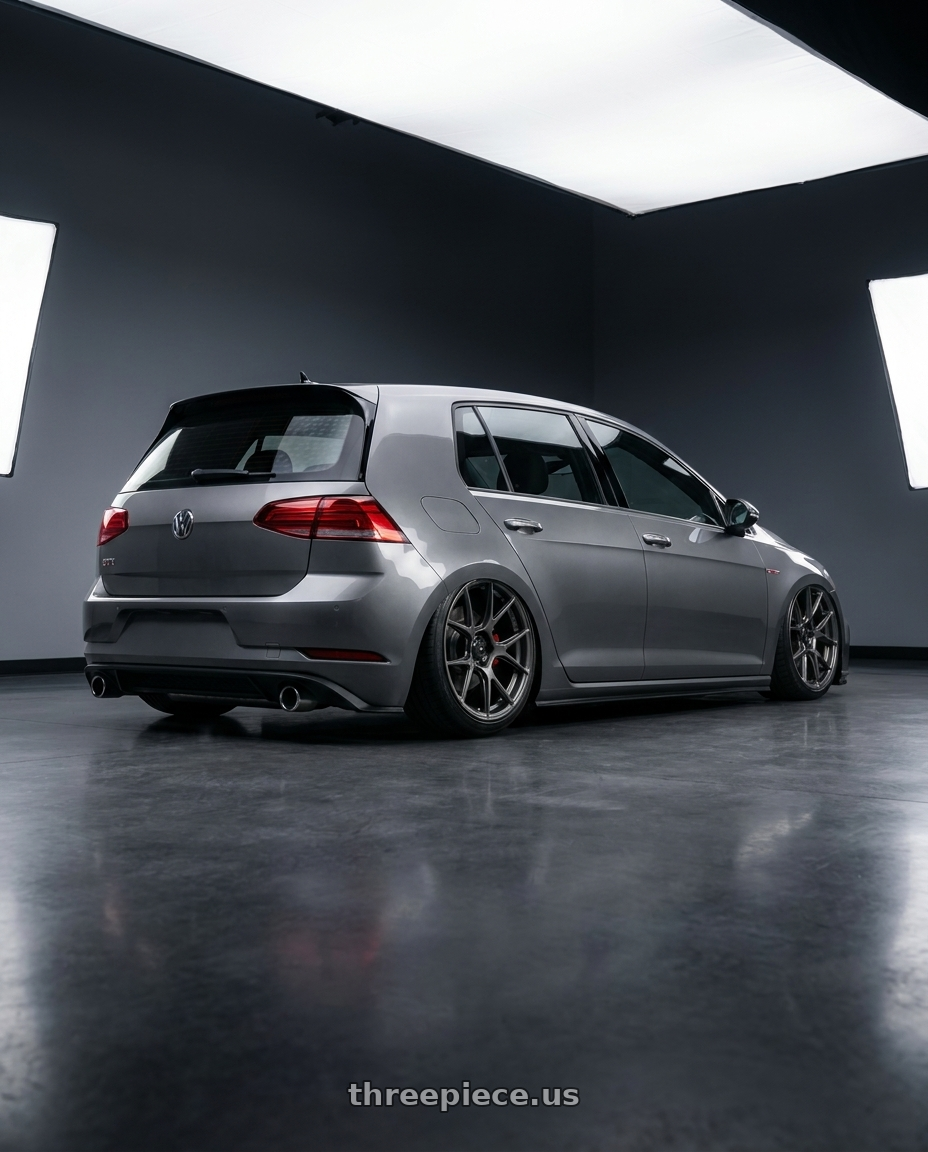 2019 Volkswagen GTI MK7 with Konig Ampliform 5x112 19x8.5+32 Dark Metallic Graphite wheels rear three quarter view slight stretch tires