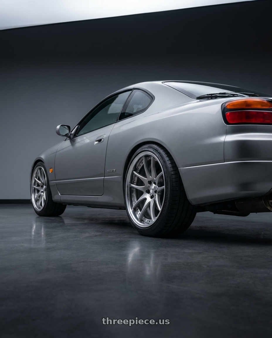 2001 Nissan Silvia S15 with Work Emotion Cr 3P 5x114.3 18x9.5+35 L Disk Burning Silver wheels rear three quarter view square tires