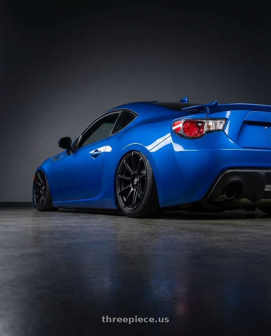 2017 Subaru BRZ with Konig Control 5x100/5x114.3 18x8+45 Matte Black wheels rear three quarter view slight stretch tires