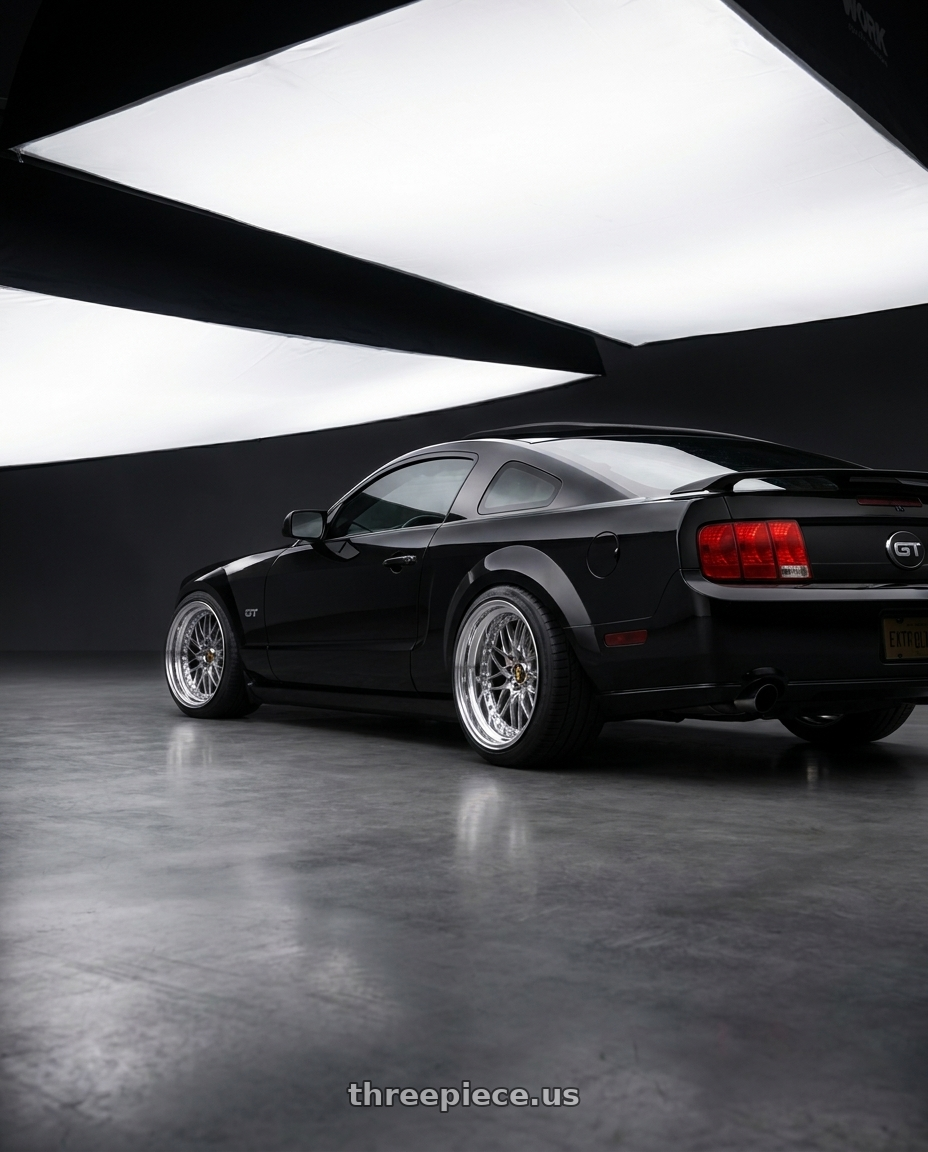 2005 mustang gt with Work Emitz Chrome 5x114.3 19x9.0 +45 wheels rear three quarter view square tires