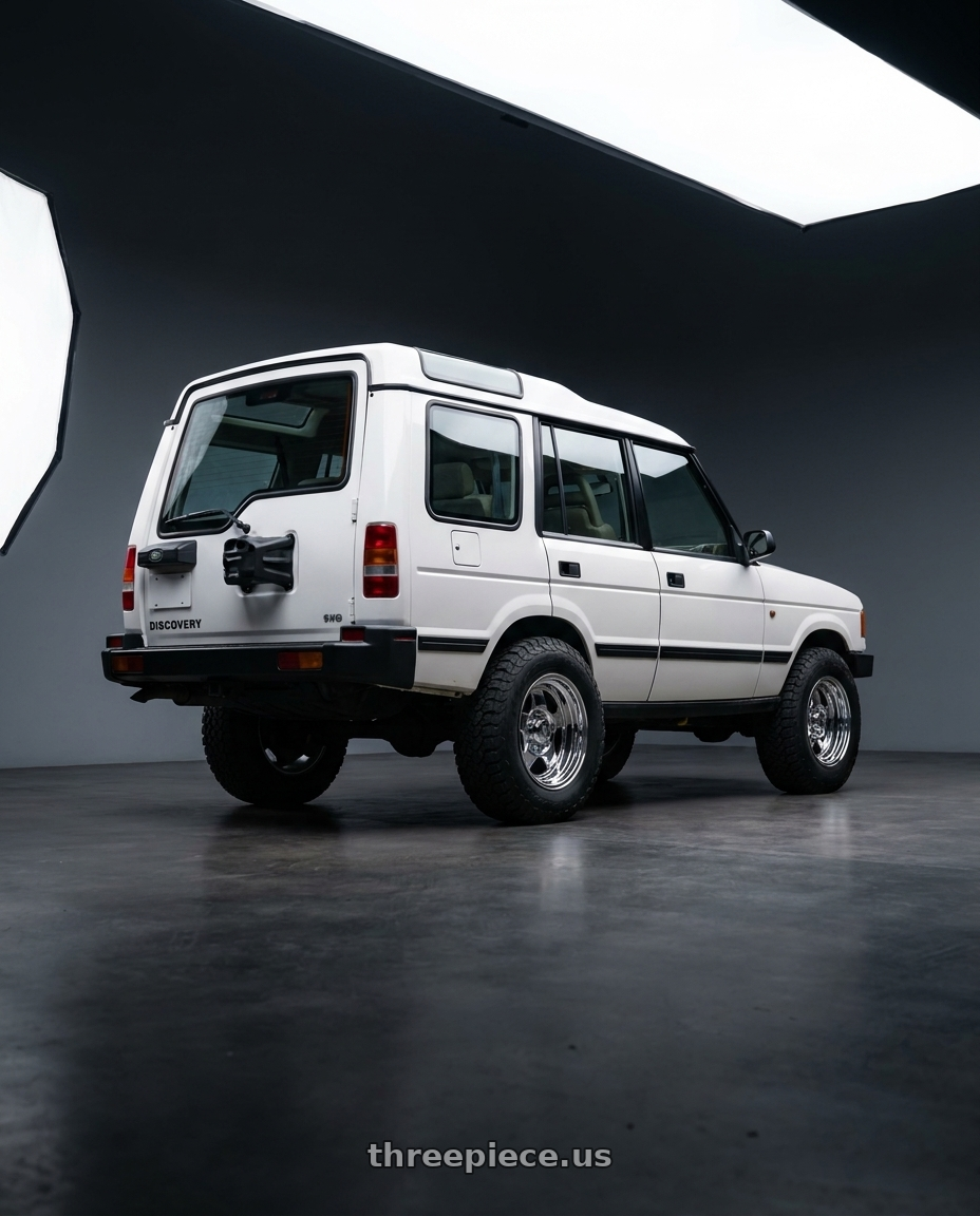 1996 Land Rover Discovery with Nomad Cap   94W - CAP-544B-85-TIS wheels rear three quarter view meaty tires