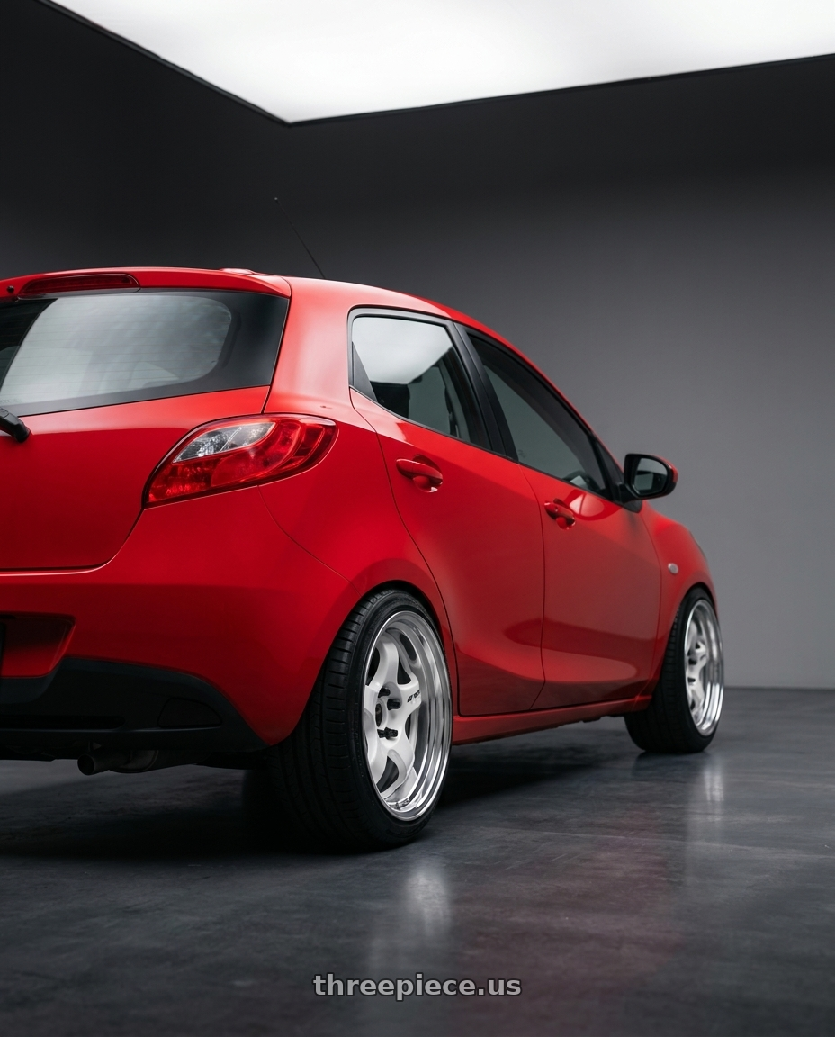 2012 mazda 2 with Work Meister S1 2P 4x100 15x6.5+38 O Disk White wheels rear three quarter view square tires
