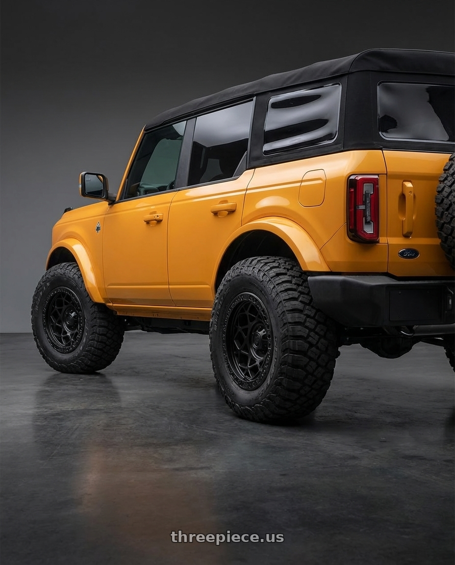 2024 Ford Bronco with Fuel 1PC D120 UNIT BEADLOCK 6X139.7 17X9 -15 BLACKOUT wheels rear three quarter view meaty tires