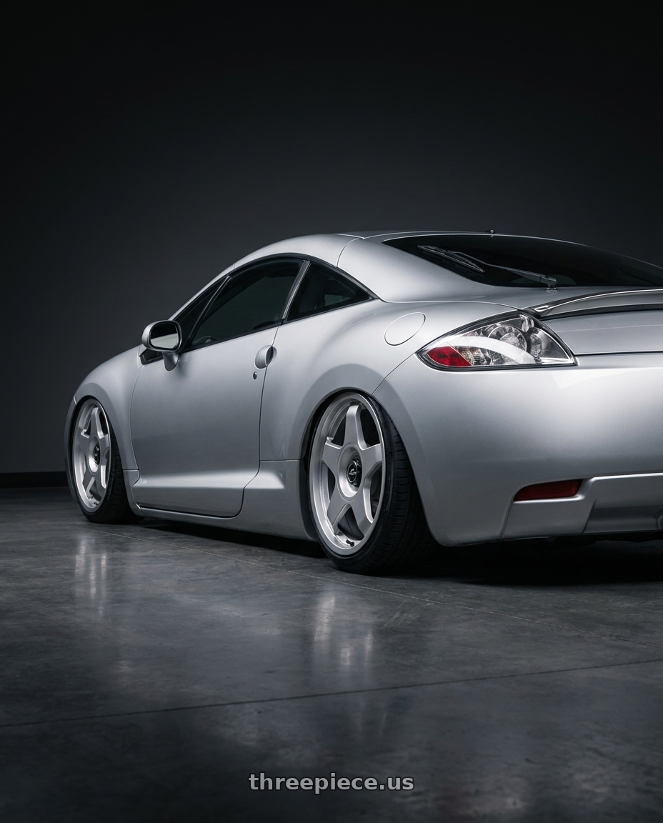 2010 Mitsubishi Eclipse with fifteen52 CHICANE 5x114.3 / 5x100 18x8.5 +35 SPEED SILVER (GLOSS SILVER) wheels rear three quarter view slight stretch tires