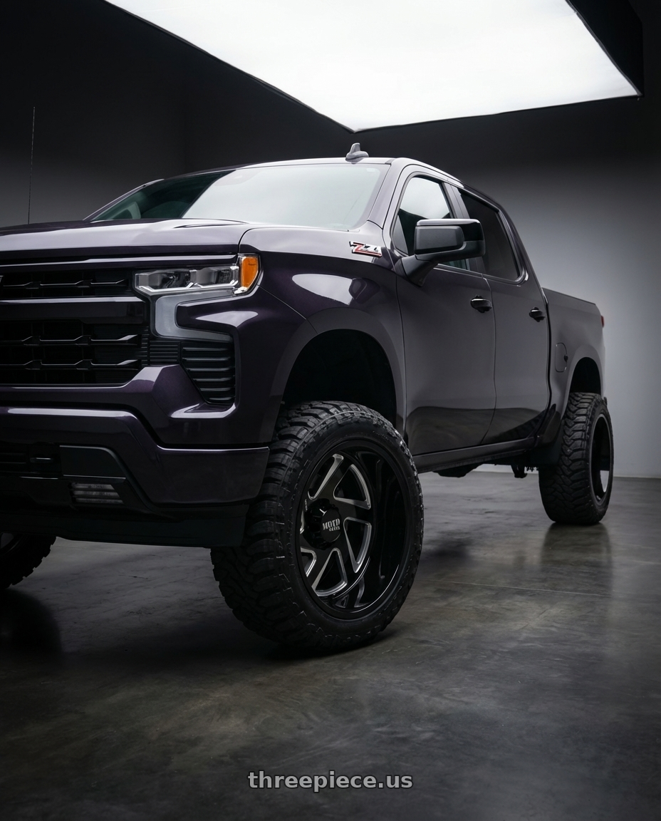 2023 Chevrolet Silverado 1500 with Moto Metal MO400 6X139.7 22X14 -76 GLOSS BLACK MILLED wheels front three quarter view lifted stance